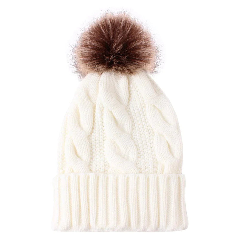 Knitted hat with plush padded fur ball