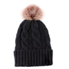 Knitted hat with plush padded fur ball